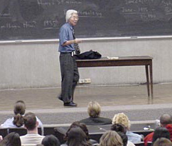 photograph of Ronald Takaki lecturing to students while standing in front of a blackboard