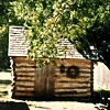 photograph of a simple log cabin