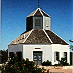 photograph of the Vereins Kirche community church, which is eight sided and painted white with a steeple